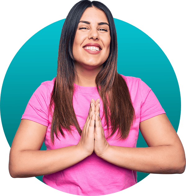 A woman smiles as she holds her hands together ready to pray for any prayer requests